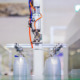 Stack of food containers on conveyor belt of plastic injection molding machine