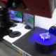 Professional 3D scanner scanning an industrial object plastic molding placed on a turntable, metrology concept