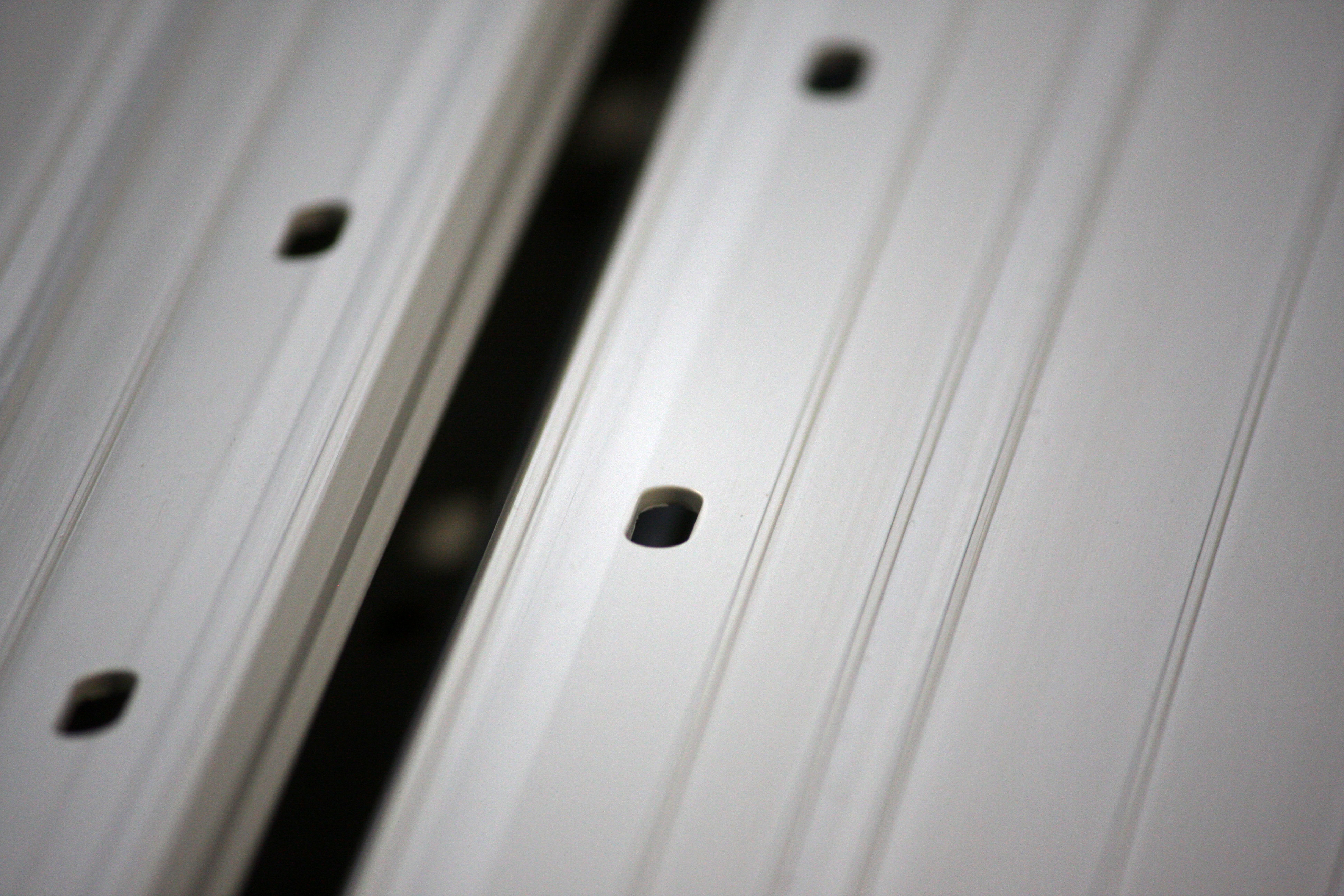 Operator carrying out secondary operations on custom extruded profiles at Goodfish Group's UK manufacturing site